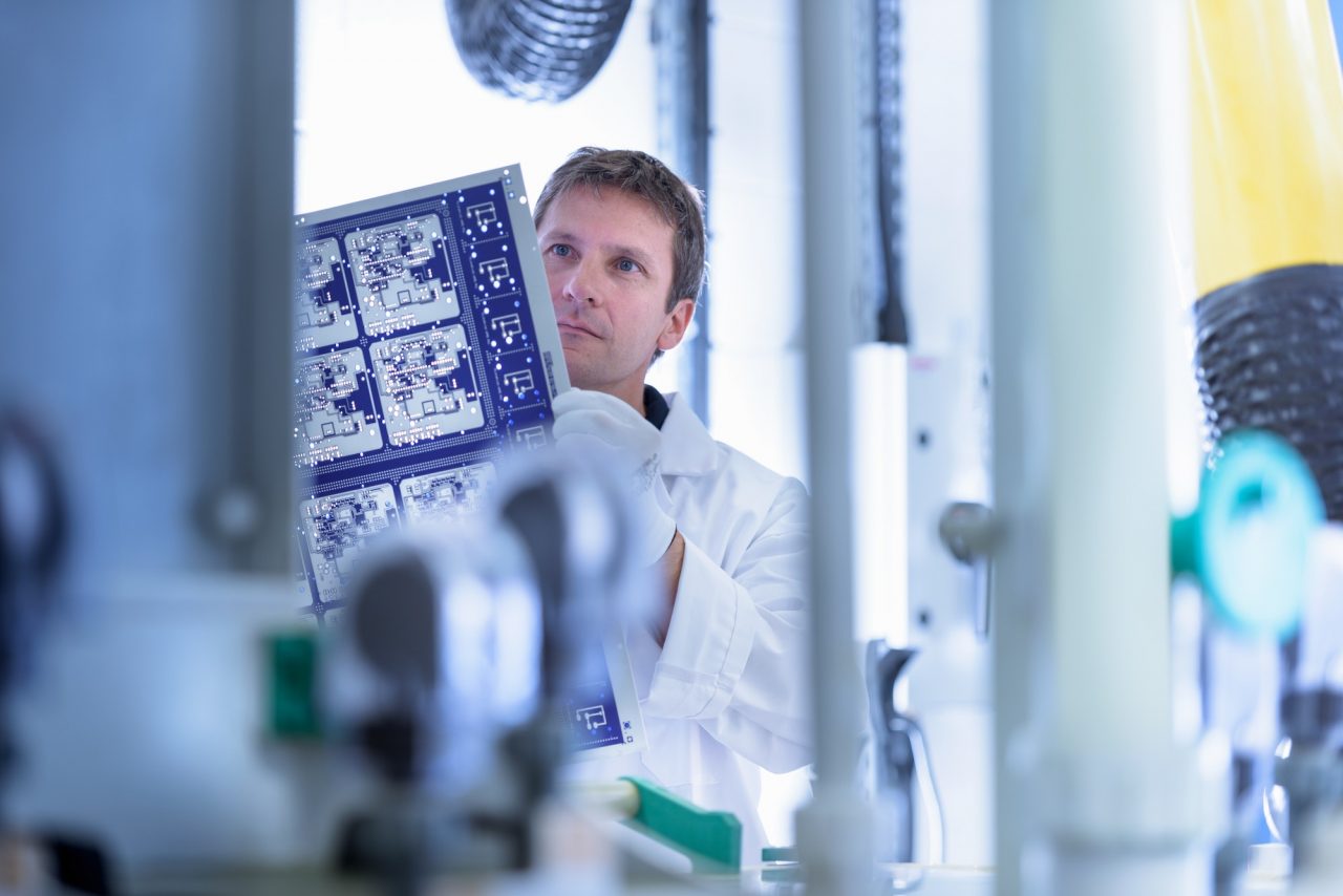 About us 8 worker inspecting circuit board by processing plant in circuit board factory